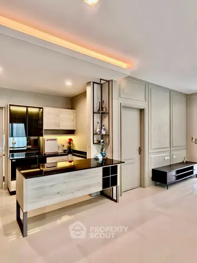 Modern open-layout kitchen with sleek cabinetry and stylish decor