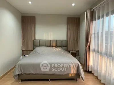 Cozy bedroom with natural light and modern decor