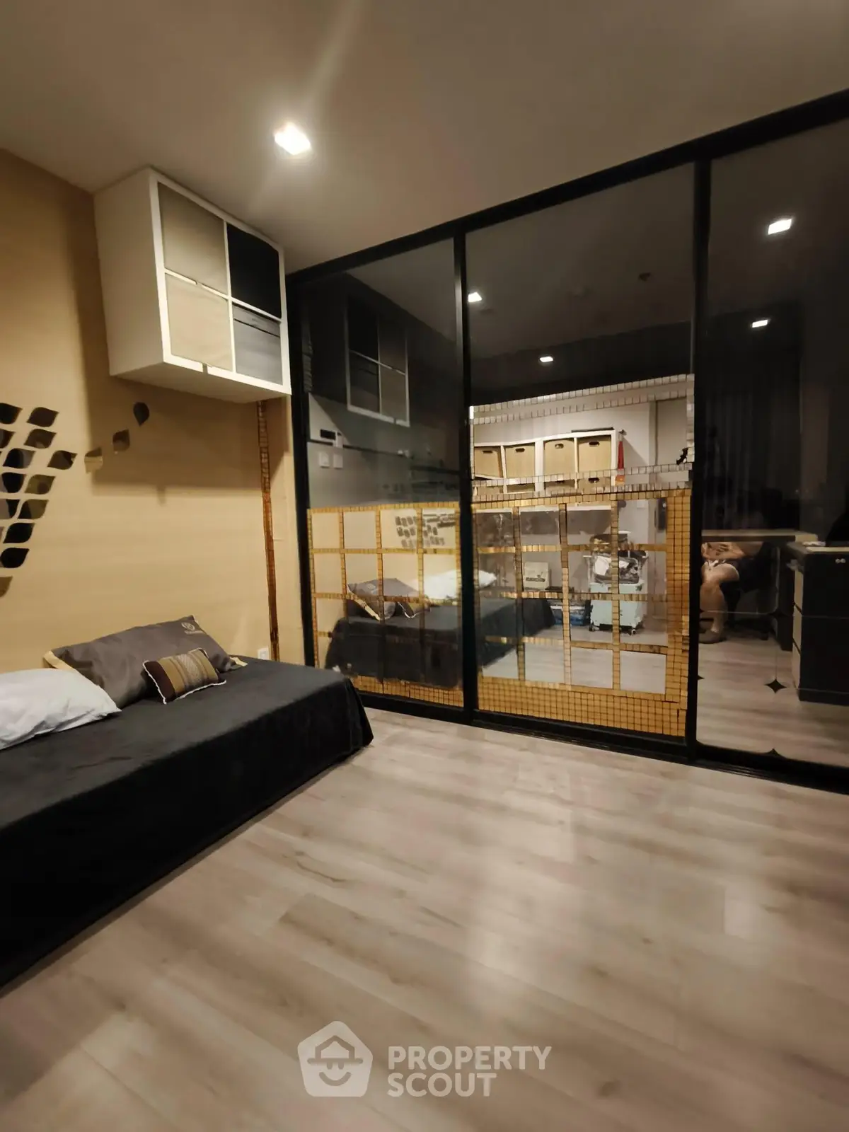 Modern living room with glass partition and stylish decor