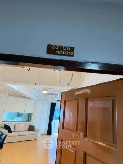 Spacious living room with wooden flooring and modern decor