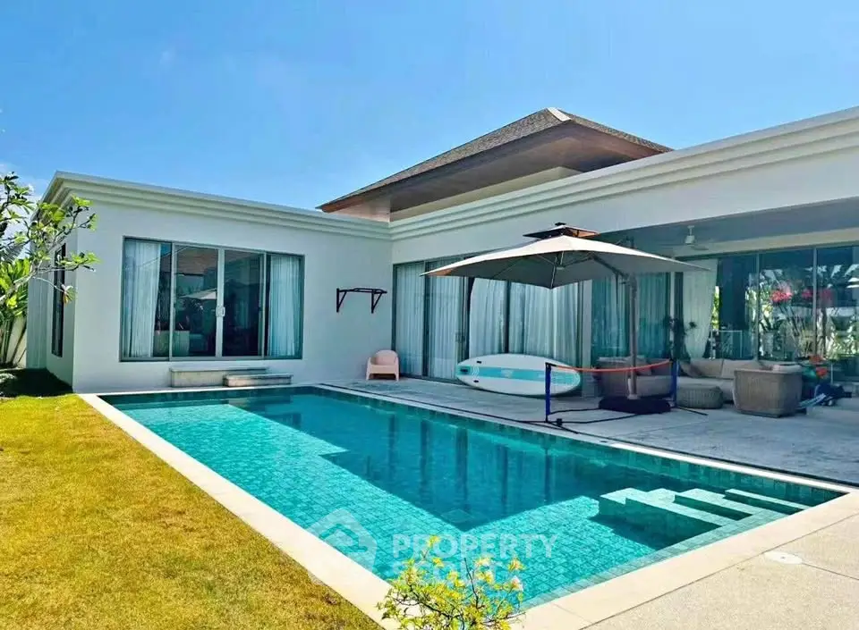 Luxurious villa with private pool and modern design in sunny setting