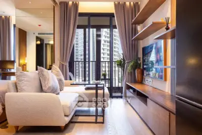 Luxurious modern living room with city view, elegant decor, and spacious layout in high-rise apartment.