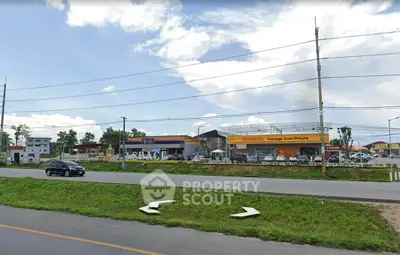 Commercial property with ample parking and roadside visibility