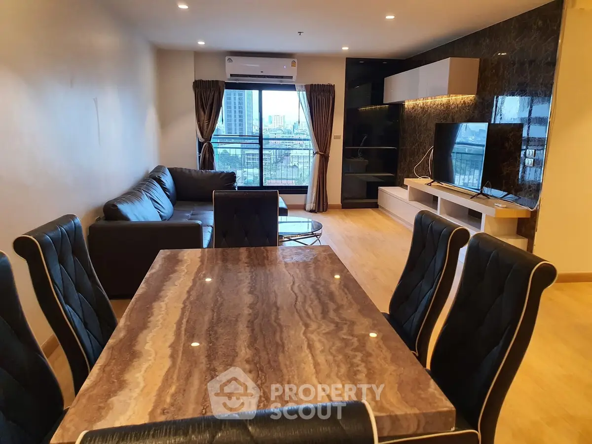 Spacious modern living room with city view and elegant dining area