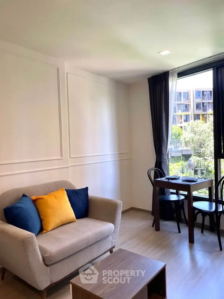 Bright living room with modern decor and large window view