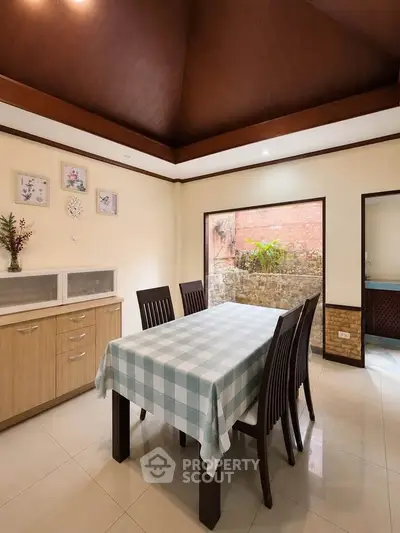 Spacious dining area with elegant table setting and natural light