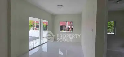 Spacious empty room with large windows and glossy floor tiles, perfect for customization.