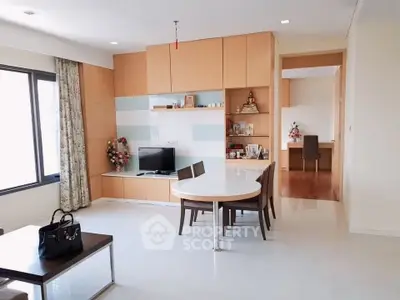 Spacious modern living room with dining area and natural light