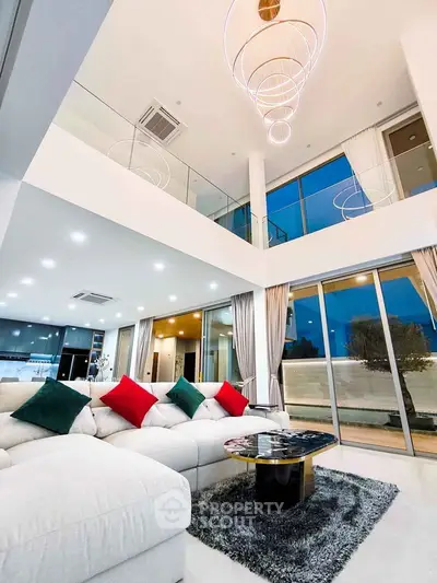 Luxurious modern living room with high ceilings and elegant lighting