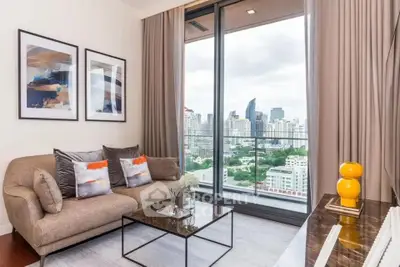 Modern living room with city view, stylish decor, and large windows in a high-rise apartment.