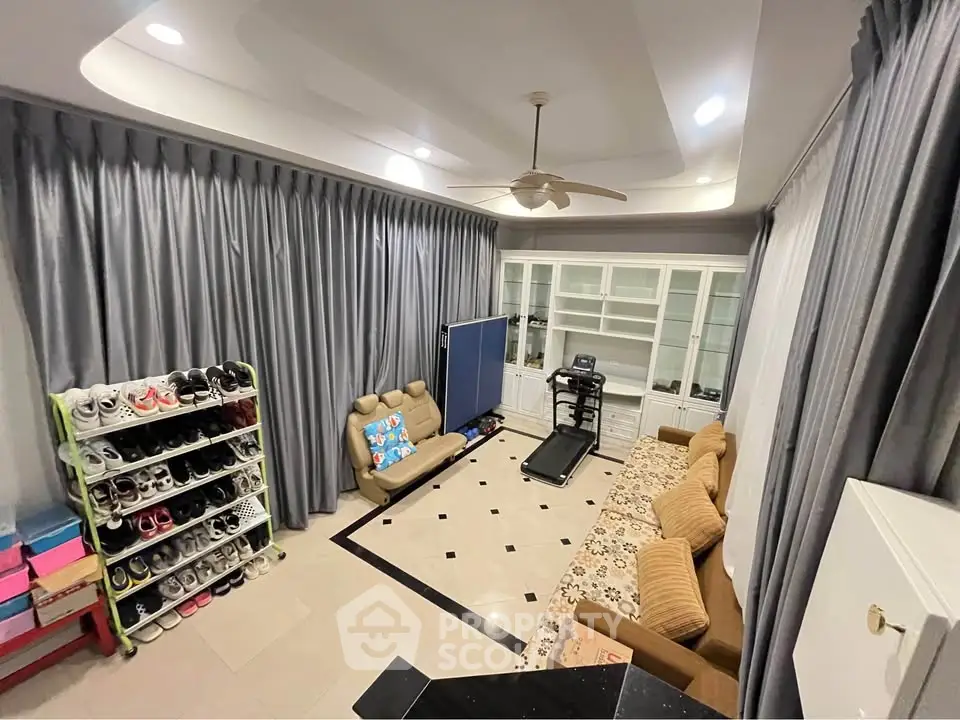 Spacious living room with modern decor and exercise equipment