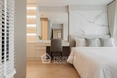 Luxurious modern bedroom with elegant decor and plush bedding