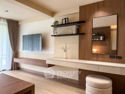 Modern living room with stylish decor and wall-mounted TV