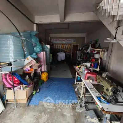 Spacious storage area with sewing equipment and materials, ideal for creative projects.