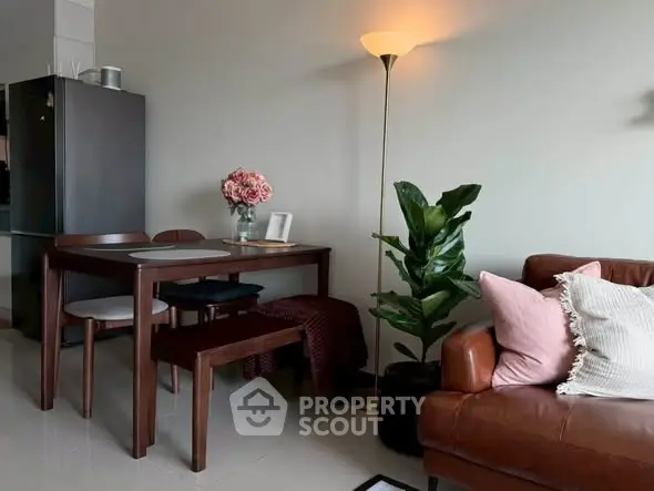 Cozy living room with elegant dining set and stylish decor, perfect for modern living.
