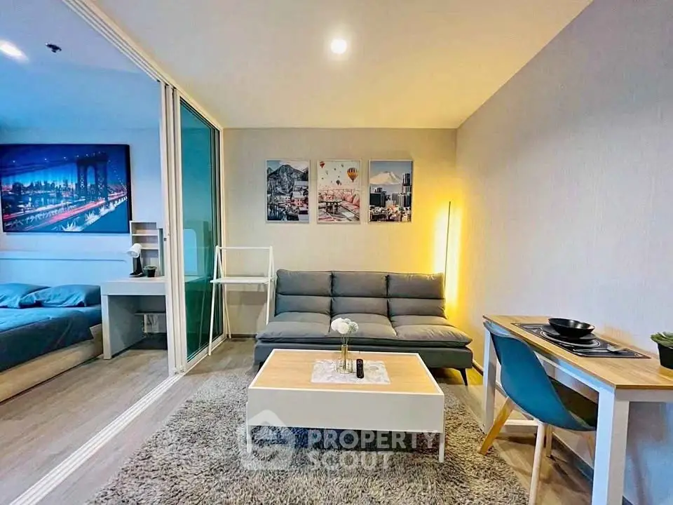 Modern living room with cozy decor and adjacent bedroom in stylish apartment