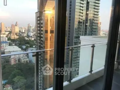 Stunning high-rise balcony view with cityscape and modern architecture.