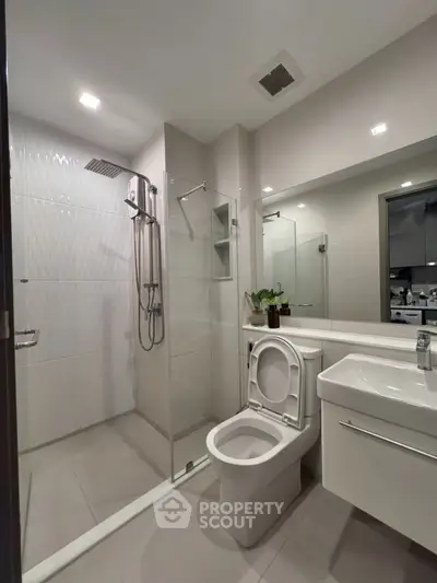 Modern bathroom with glass shower and sleek fixtures