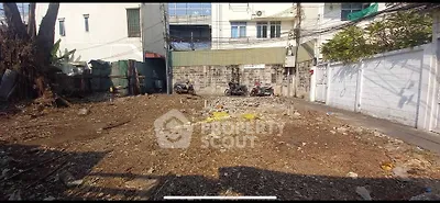 Vacant land plot in urban area ready for development, ideal for residential or commercial projects.