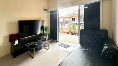 Modern living room with sleek TV setup and outdoor view