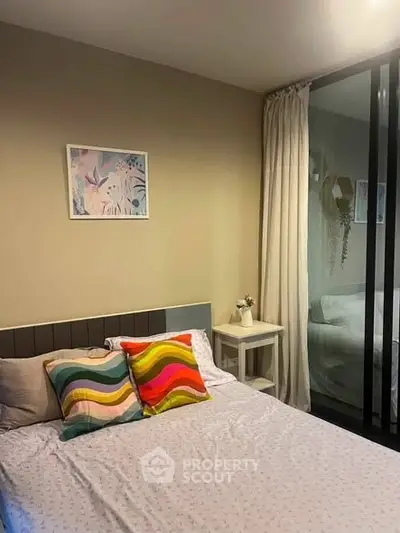 Cozy bedroom with colorful pillows and modern decor