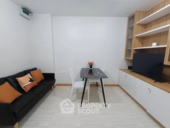 Modern living room with sleek furniture and built-in storage