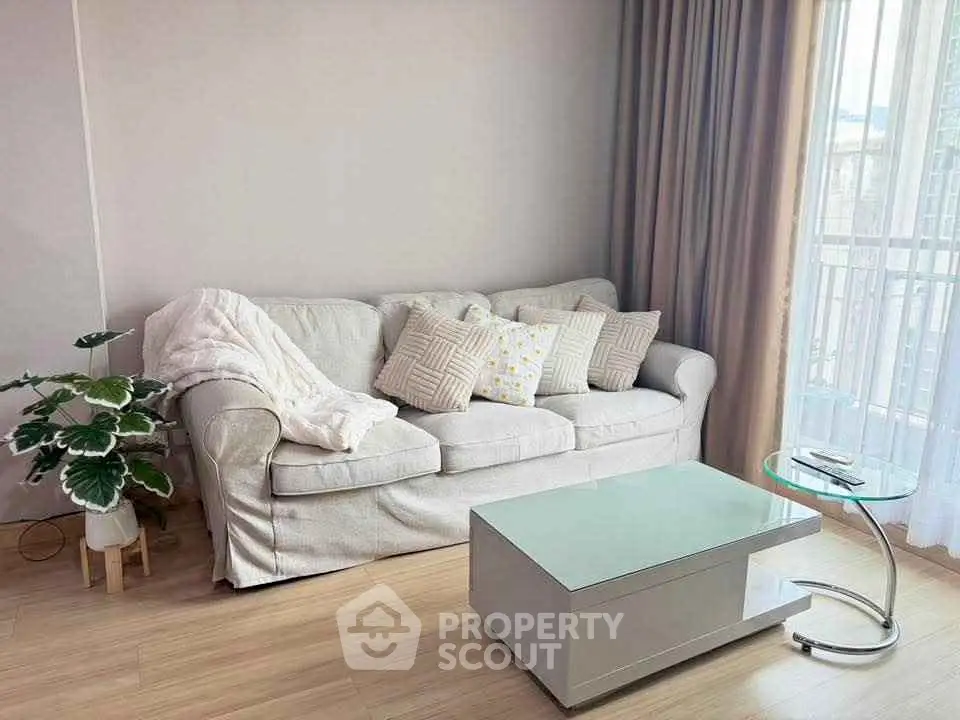 Cozy living room with elegant sofa and modern coffee table, perfect for relaxation.