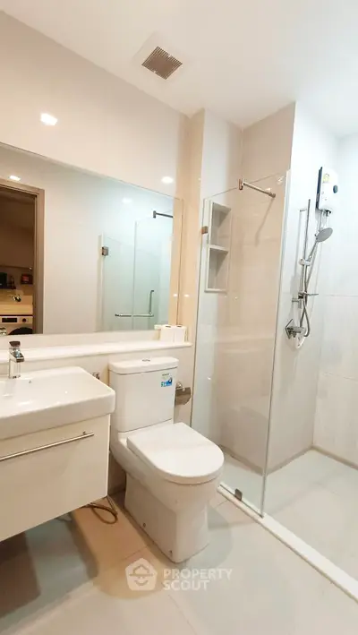 Modern bathroom with glass shower and sleek fixtures