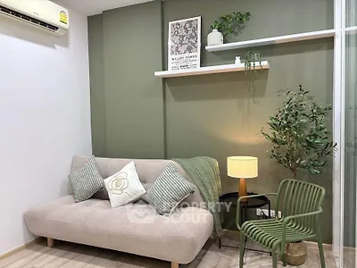 Stylish living room with modern decor, cozy sofa, and elegant lighting in a chic apartment.