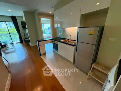 Modern kitchen with sleek appliances and open layout in a bright apartment