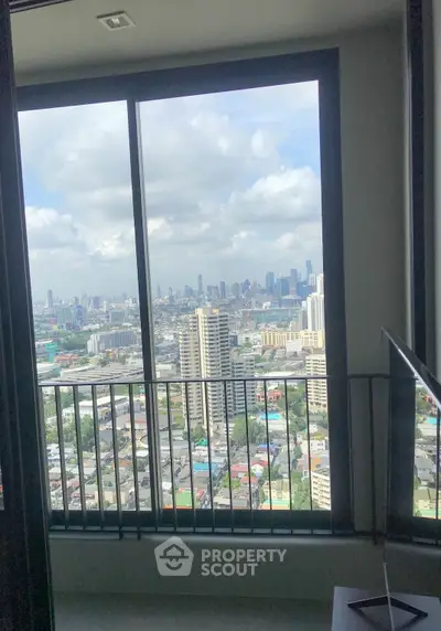 Stunning cityscape view from high-rise apartment window, showcasing urban skyline and vibrant city life.