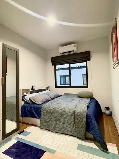 Cozy bedroom with modern decor and natural light