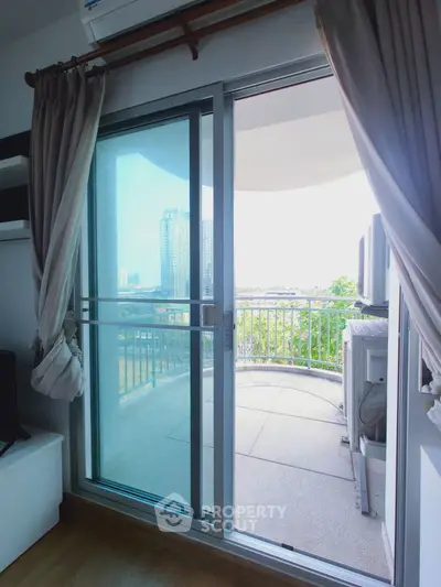 Spacious balcony with city view from modern apartment