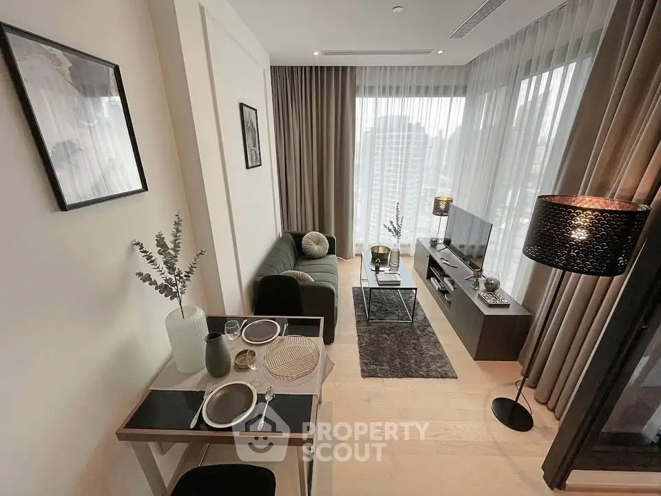 Modern living room with stylish decor and dining area in a high-rise apartment.