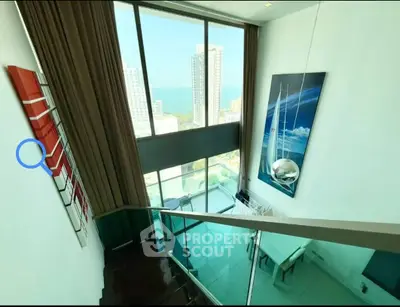 Stunning high-rise apartment with floor-to-ceiling windows and breathtaking city views.