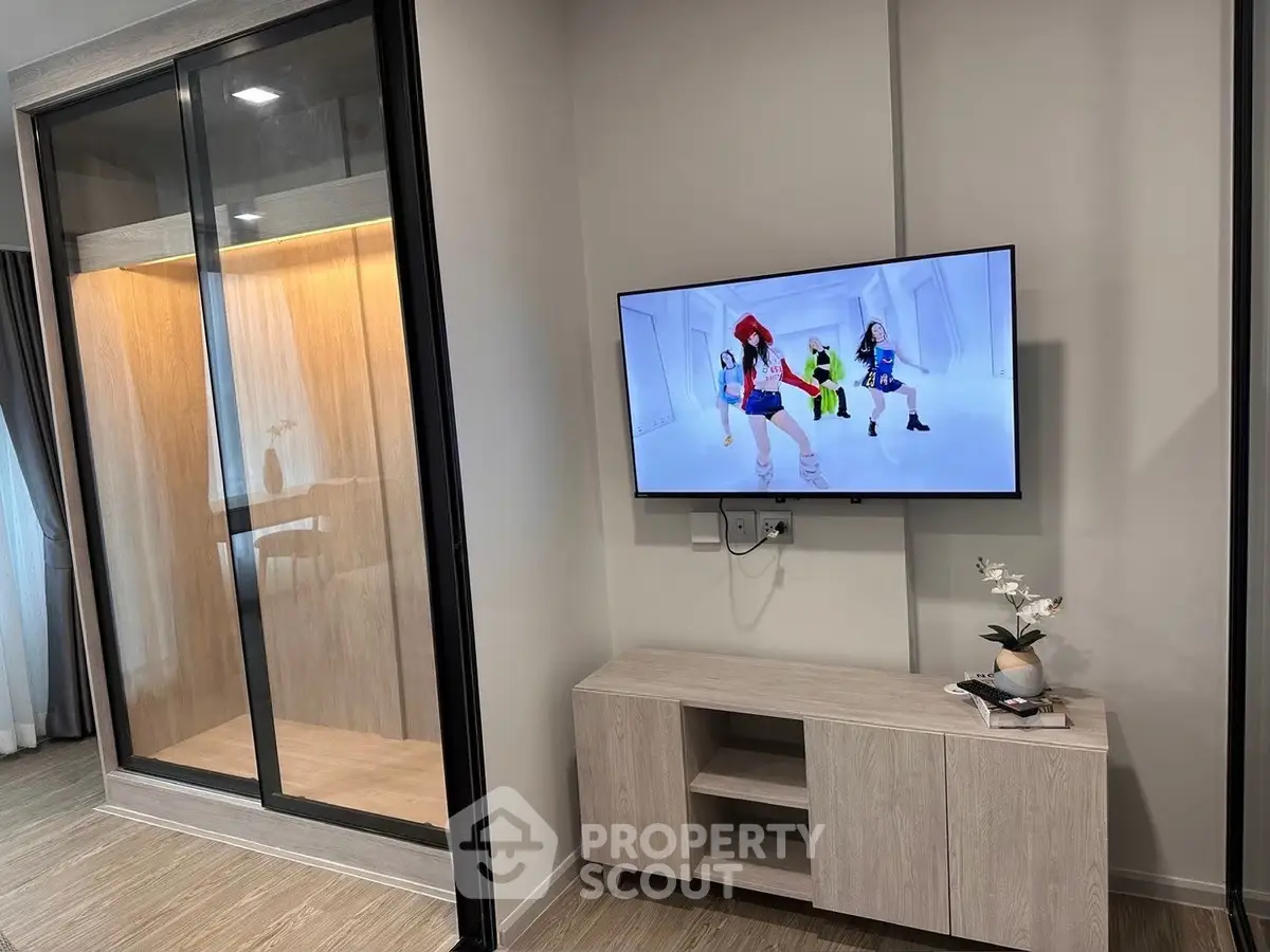 Modern living room with wall-mounted TV and stylish decor