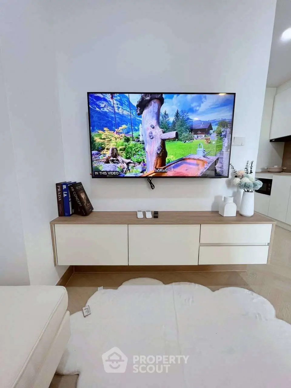 Modern living room with wall-mounted TV and stylish decor