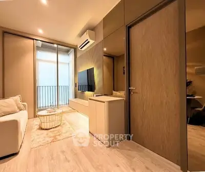 Modern living room with sleek design, featuring a cozy sofa, stylish coffee table, and wall-mounted TV.