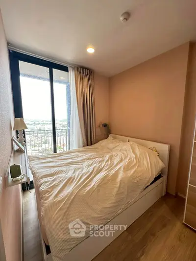 Cozy bedroom with balcony view in modern apartment