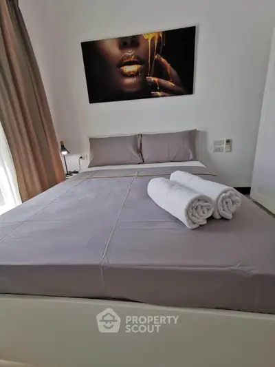 Luxurious bedroom with elegant decor and plush bedding, perfect for relaxation.