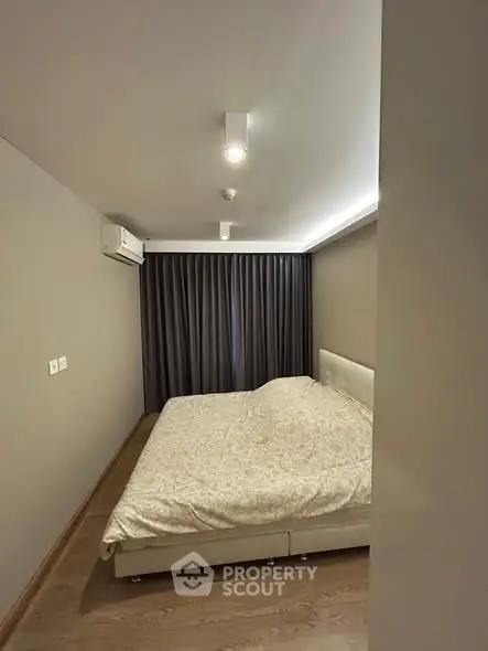 Cozy modern bedroom with minimalist design and soft lighting