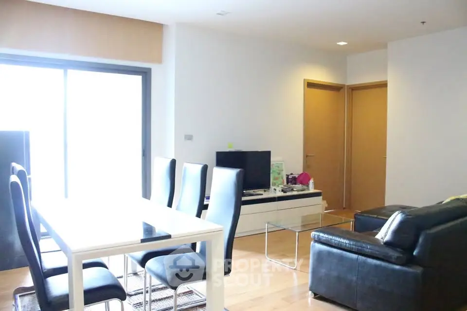 Spacious modern living room with sleek furniture and natural light