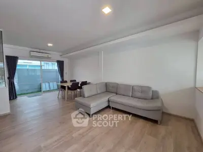 Spacious modern living room with sleek furniture and natural light