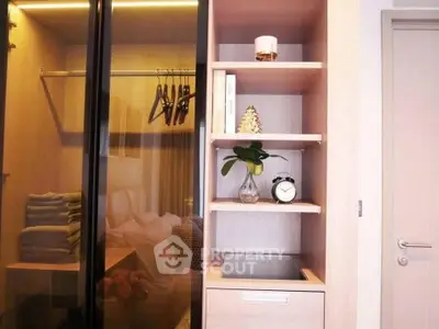 Modern bedroom with stylish wardrobe and shelves, featuring elegant decor and soft lighting.