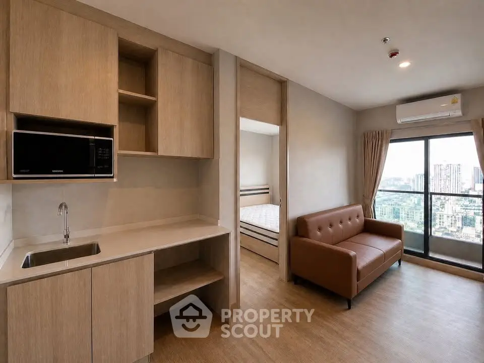 Modern apartment interior with open kitchen and city view balcony