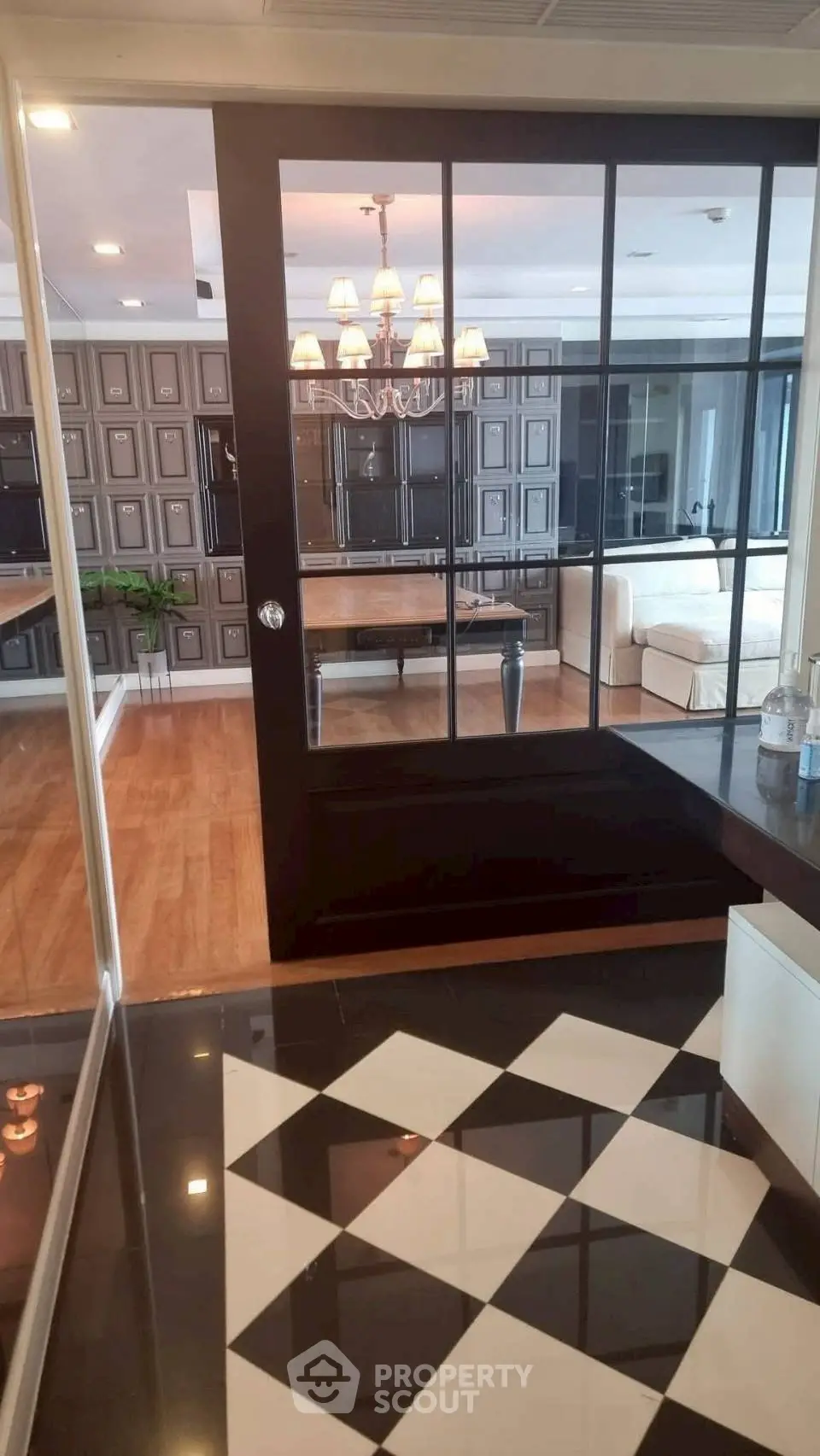 Luxurious living room with elegant decor and modern glass partition