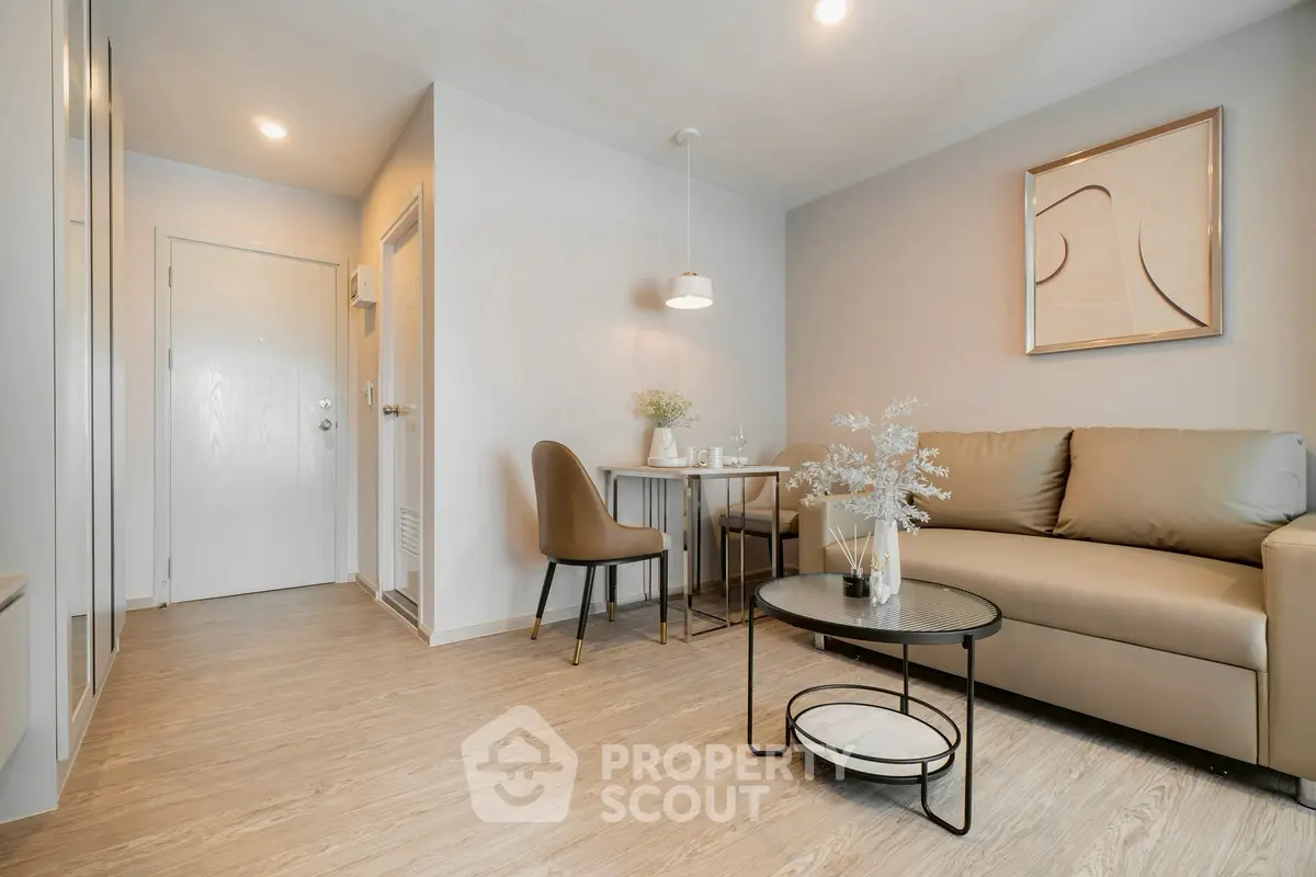 Modern living room with stylish decor and cozy seating area in a contemporary apartment.