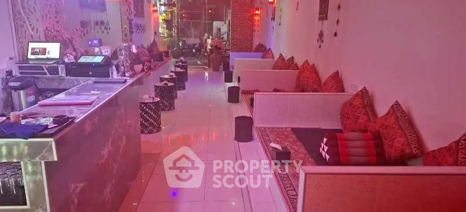 Chic lounge area with vibrant decor and cozy seating, perfect for social gatherings.