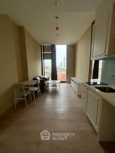 Modern apartment interior with open kitchen and city view