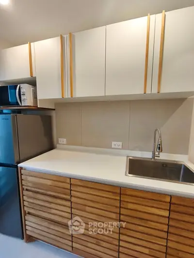 Modern kitchen with sleek cabinetry and stainless steel appliances